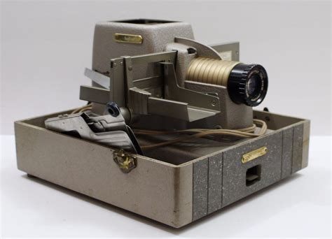Box has wear. . 1950 bell and howell projector